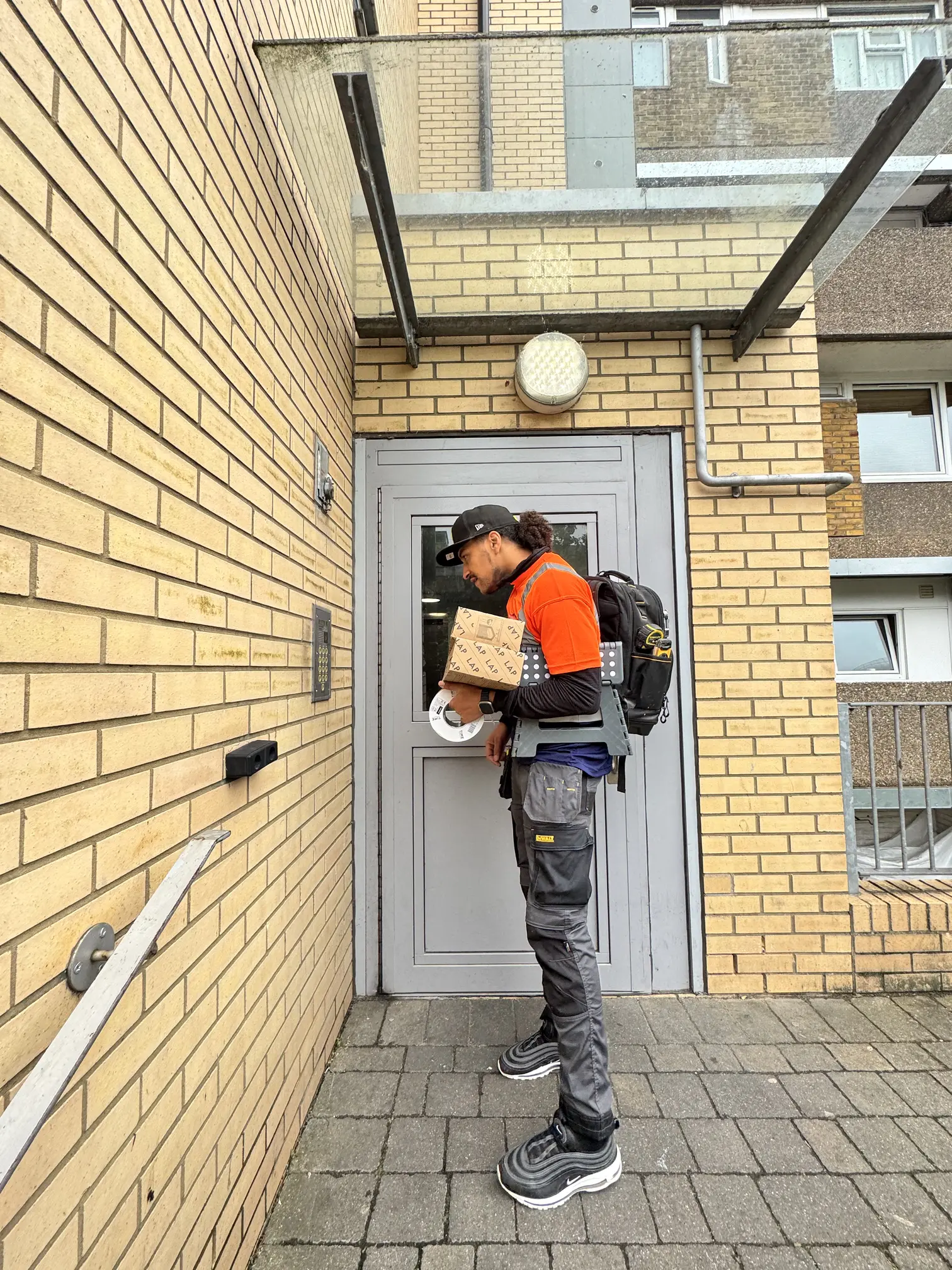 Community Heroes volunteer arriving at a property with tools and equipment